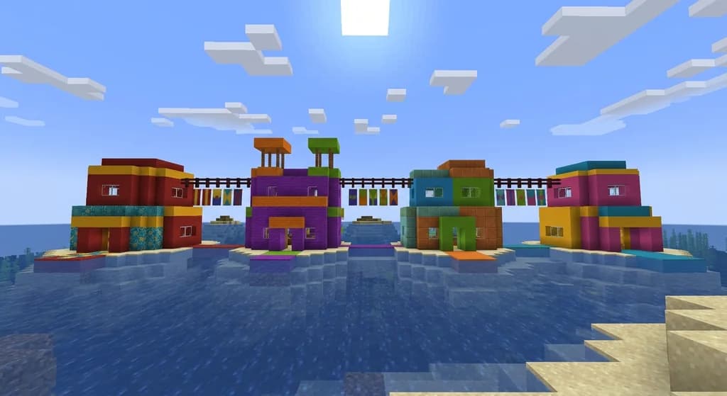 Four vibrant Minecraft builds side by side, each using a different triadic block palette of red, yellow, and cyan or purple, orange, and lime blocks, set in a flat ocean biome under bright sunlight.