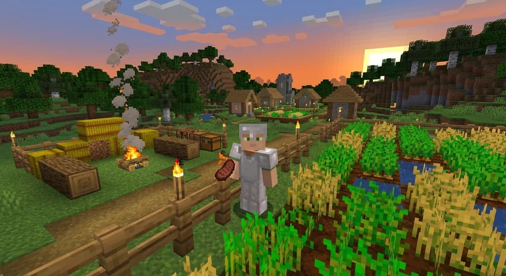 Minecraft player in iron armor holding a steak near a wheat farm at sunset, village and hills in background.