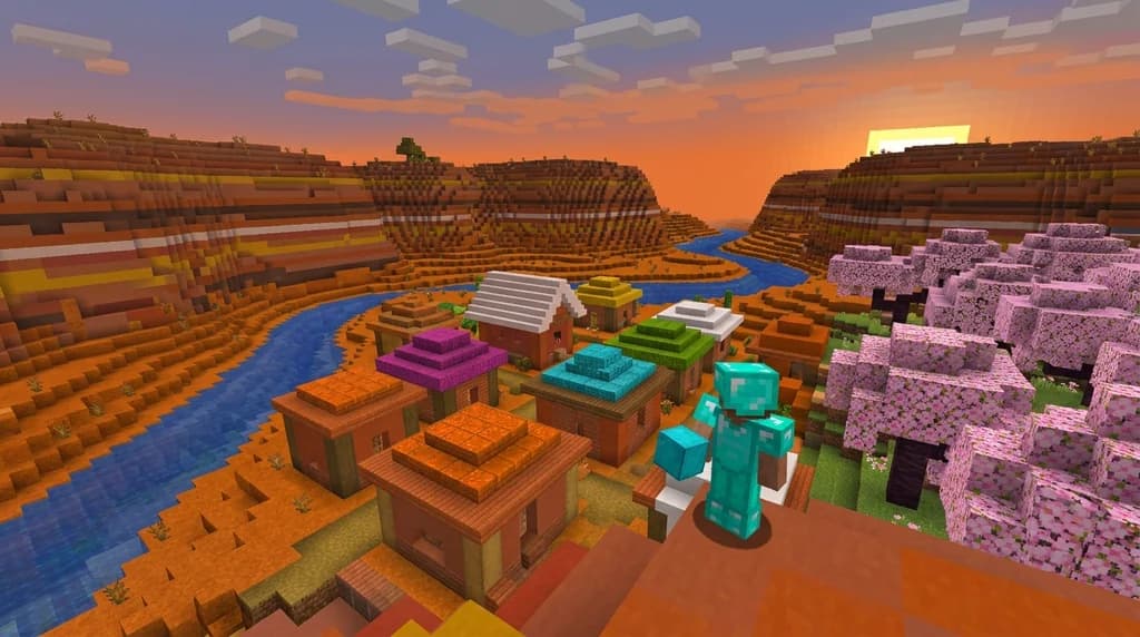 A Minecraft player admiring a colorful terracotta village in a mesa biome with cherry blossom trees.