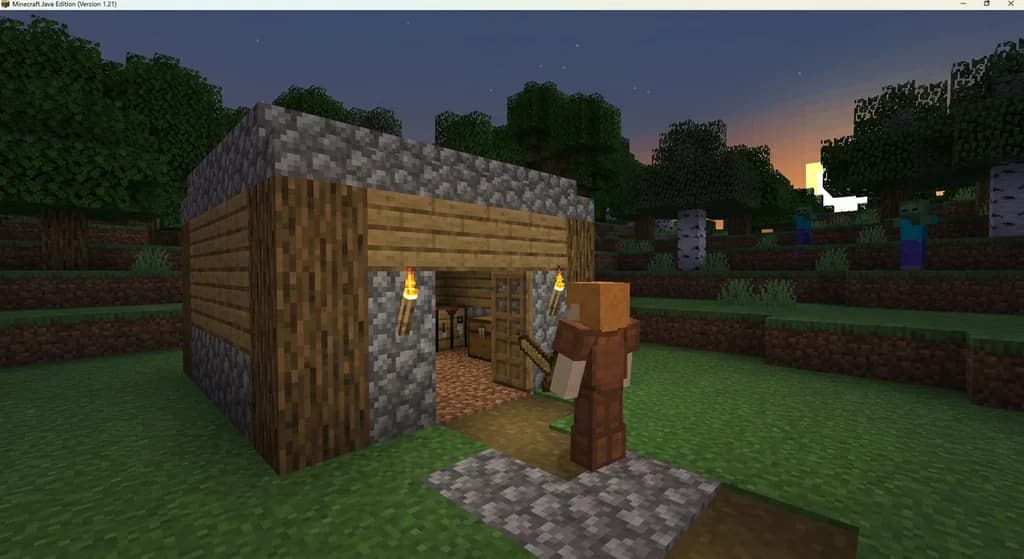 A Minecraft beginner player in leather armor standing outside a torchlit cobblestone shelter at dusk with zombies approaching in the distance