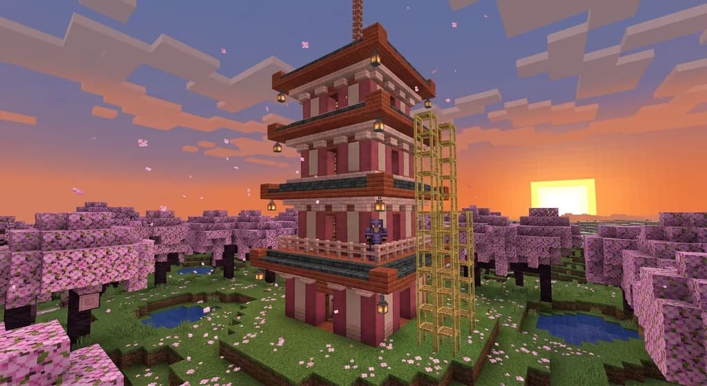 A five-tier Japanese pagoda in a cherry blossom biome, built with stripped cherry wood, deepslate tile roofs, and pink wool accents, scaffolded for construction.