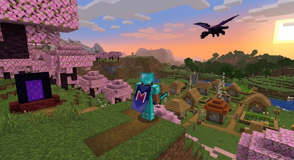 Minecraft player with a cape on a cherry blossom hill overlooking a village at sunset, with a nether portal and dragon in the background.