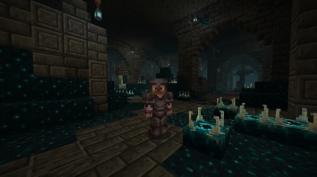A Minecraft player wearing fully trimmed netherite armor standing inside an Ancient City built from deepslate and sculk blocks, with glowing sculk shriekers visible in the dim blue light