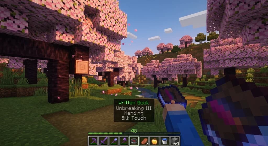 Minecraft Bedrock Edition player with the Identify control active, showing a written book's name and enchantments on a black tooltip.